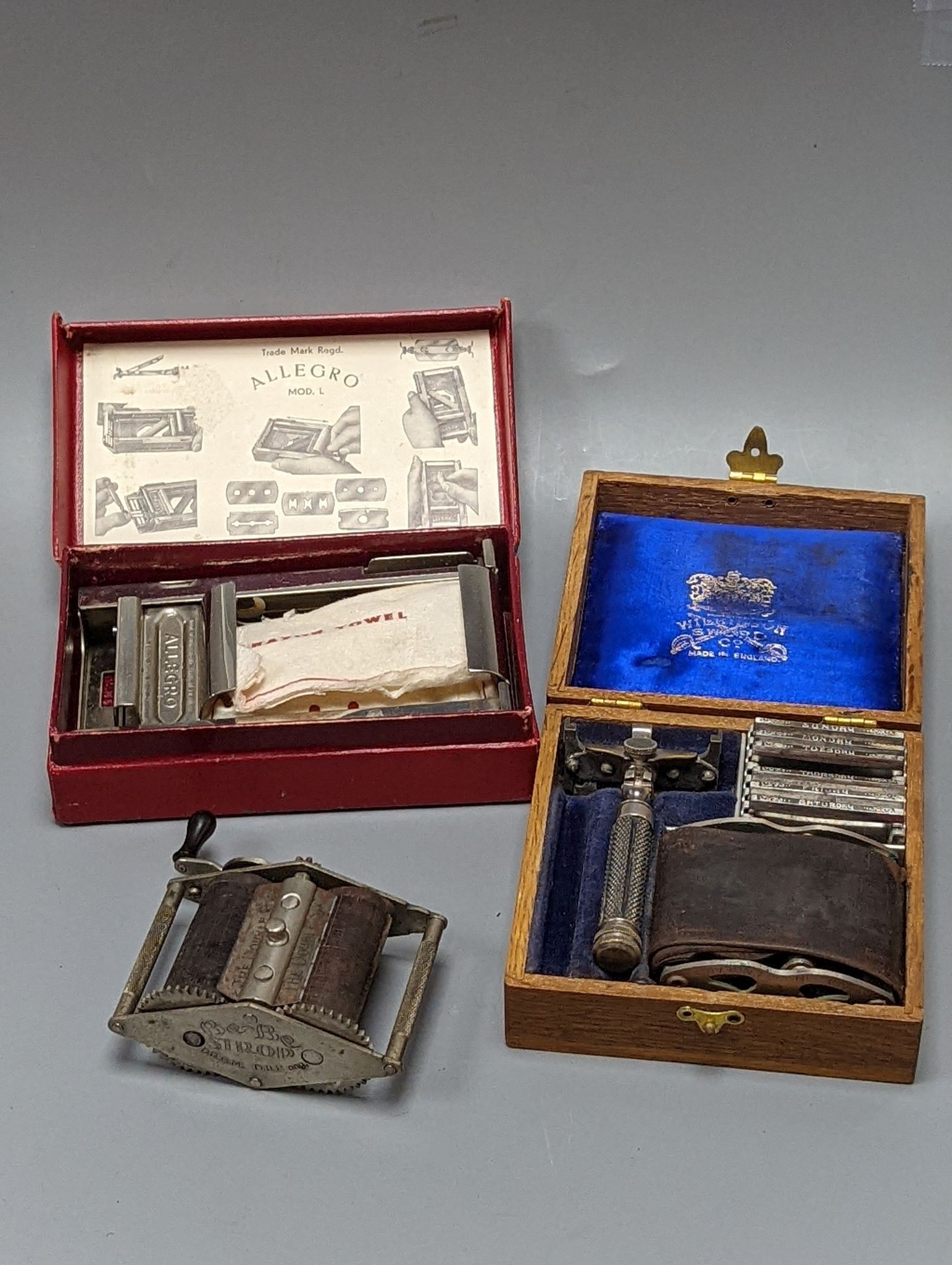 A group of cased vintage safety razors and shavers and four strops